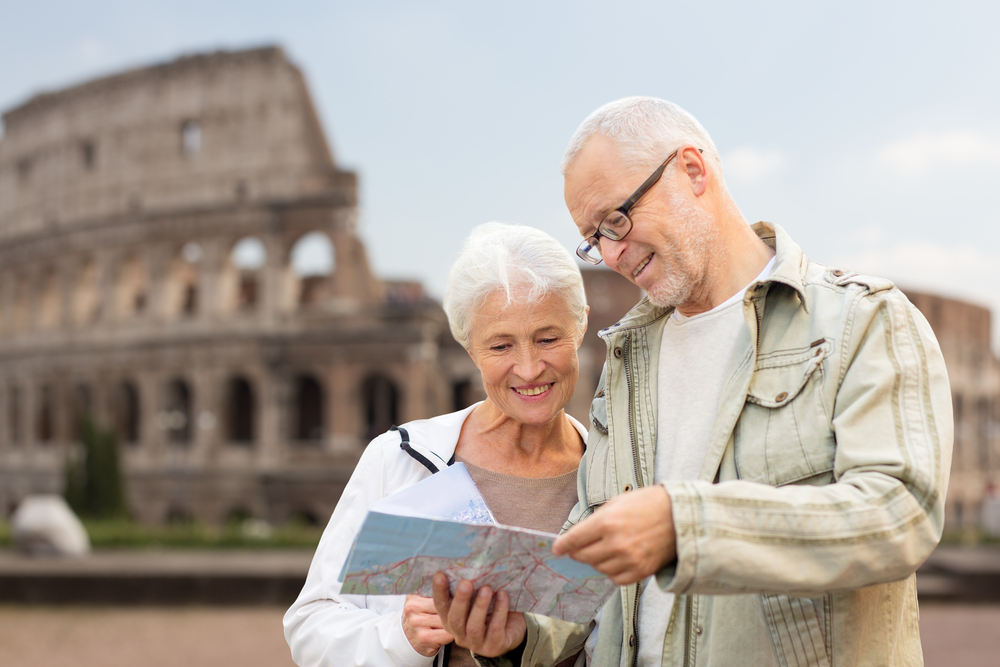 Photo of senior couple on a trip looking at a map
