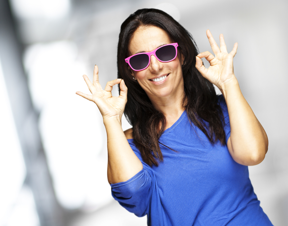 Woman with new colourful sunglasses