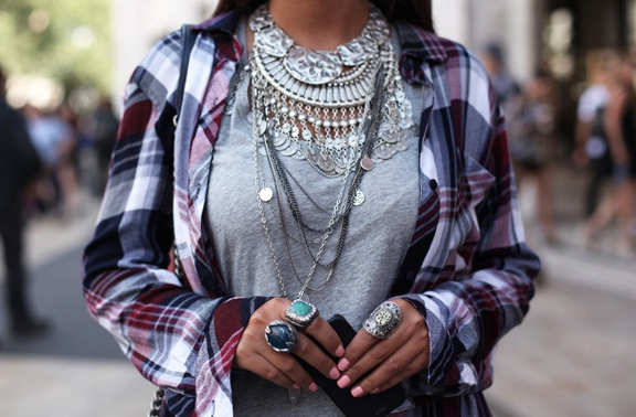 A woman wearing a lot of jewelry.