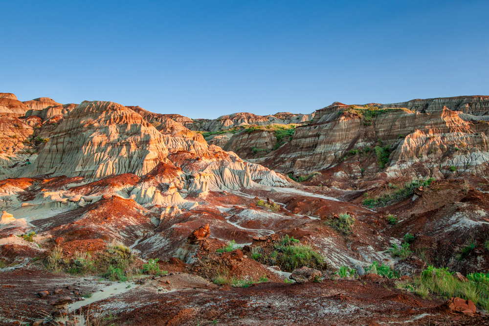 Near sunset over the Drumheller badlands at the Dinosaur Provincial Park in Alberta, where rich deposits of fossils and dinosaur bones have been found. The park is now an UNESCO World Heritage Site.