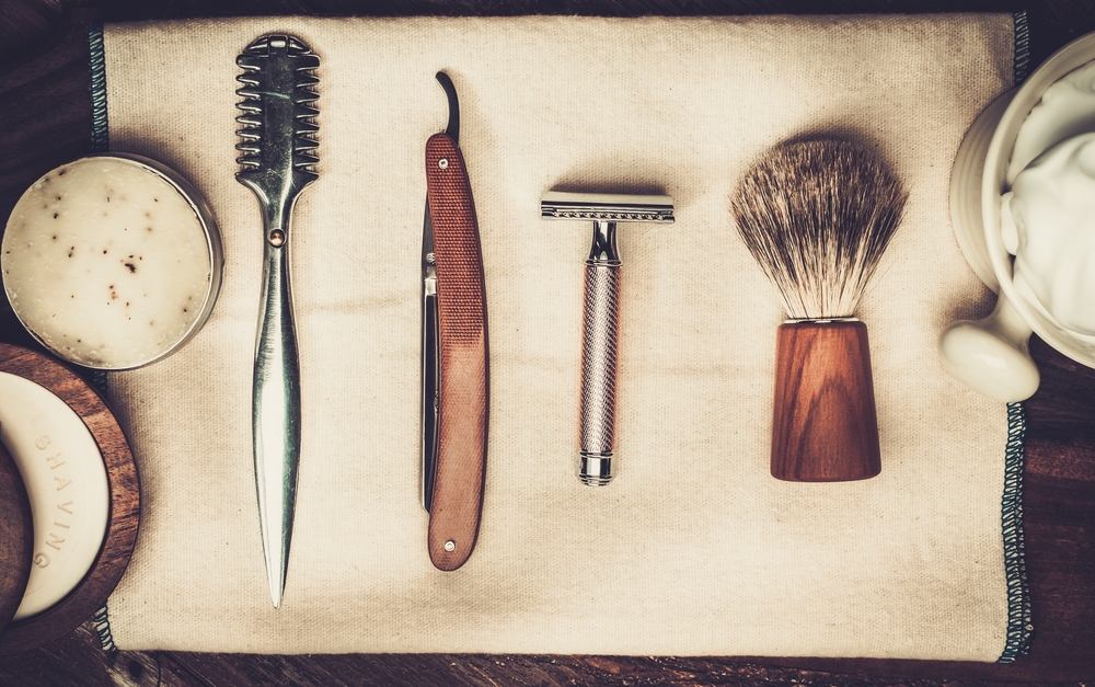 Shaving items on a wooden background