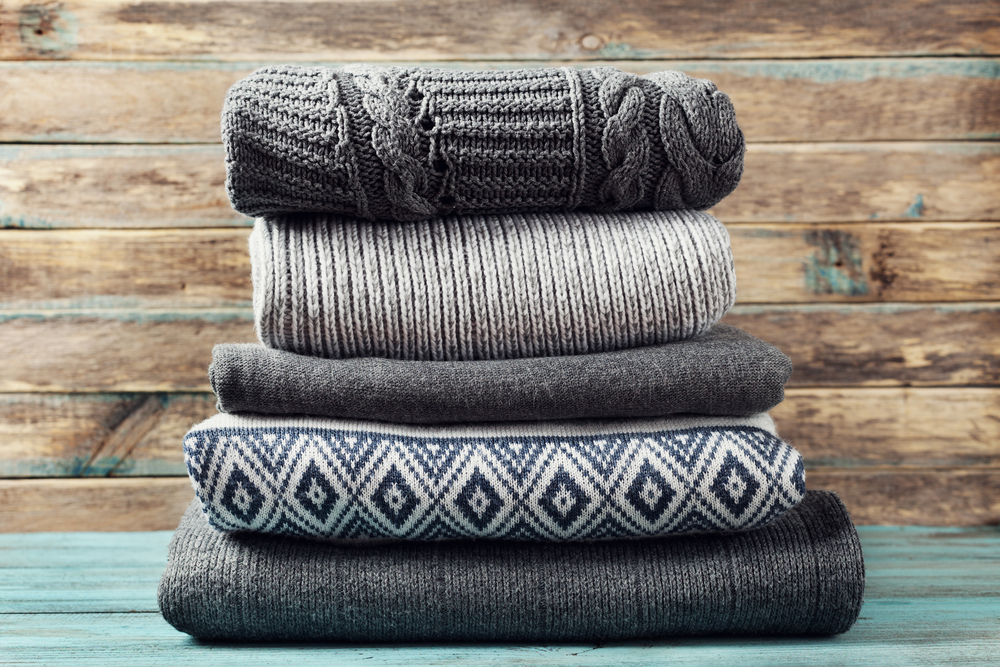 Folded sweaters and/or scarves