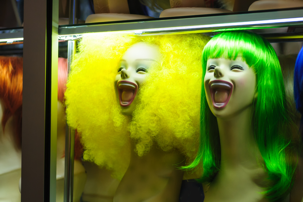 Colourful wigged mannequins in a window