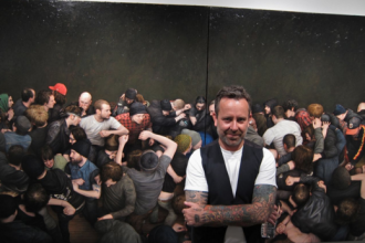 Dan Witz with one of his pieces of art