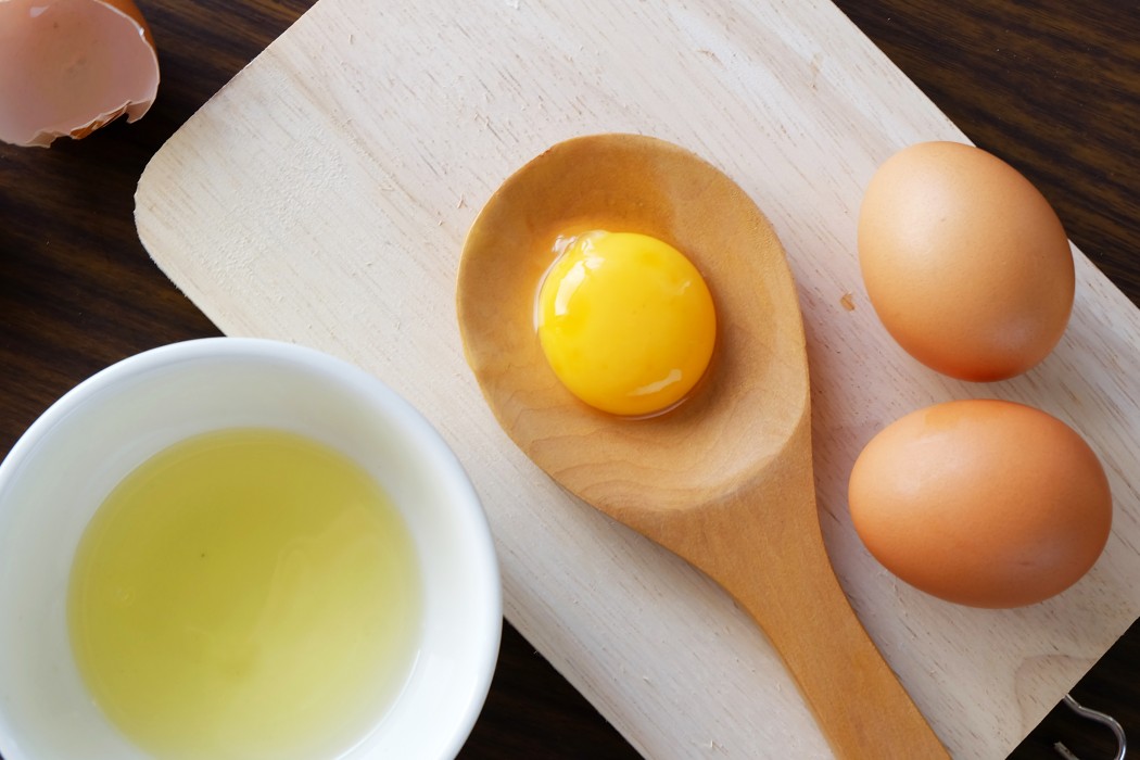 Separated egg white and yolk.
