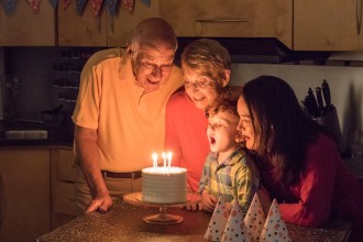 A family celebrating a birthday party.
