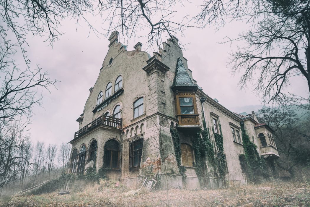 Haunted abandoned mansion in the woods