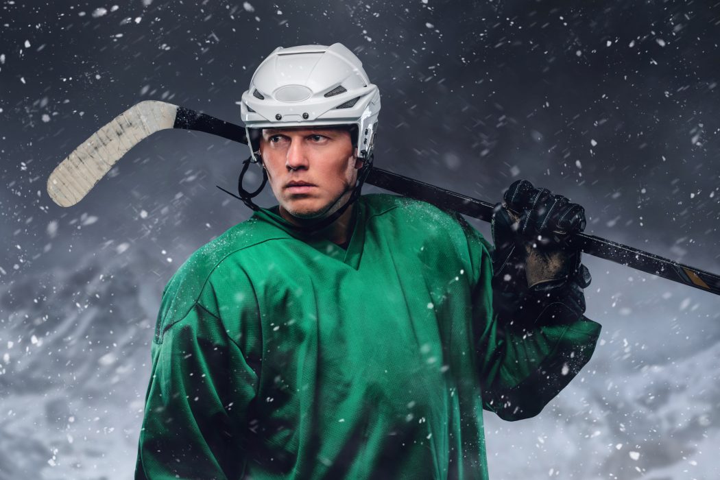 A professional portrait photo of a hockey player