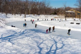 Montreal, Canada - 5th March 2016: People skating at Lafontaine Park natural ice rink